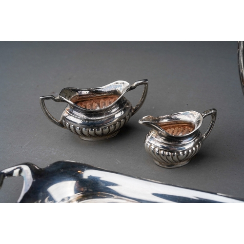 256 - An Elizabeth II silver miniature four piece Georgian style tea and coffee service on twin handled tr... 