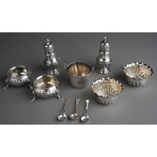 258 - A parcel of ten assorted silver cruet items, comprising a pair of late Victorian baluster pepperette... 