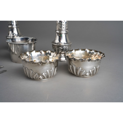 258 - A parcel of ten assorted silver cruet items, comprising a pair of late Victorian baluster pepperette... 