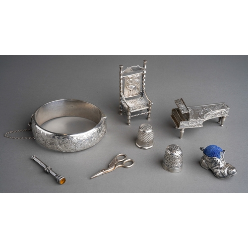 263 - A collection of small silver, white metal and plated items, comprising a miniature German white meta... 