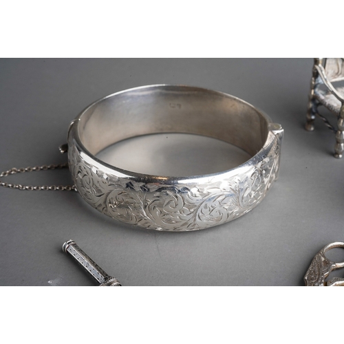 263 - A collection of small silver, white metal and plated items, comprising a miniature German white meta... 