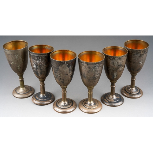 266 - A set of six early 20th Century Russian 875 standard silver tots /cups, engraved decoration, gilt in... 