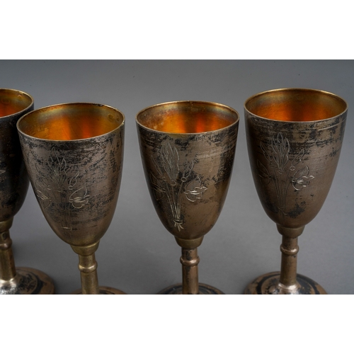 266 - A set of six early 20th Century Russian 875 standard silver tots /cups, engraved decoration, gilt in... 