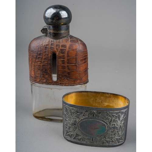 274 - An early 20th Century glass spirit flask, with silver plate cover and detachable engraved cup, the u... 