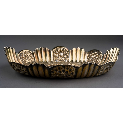 291 - A cased Victorian silver wavy rimmed oval dish, repousse decorated with foliate scrolls and fluting,... 