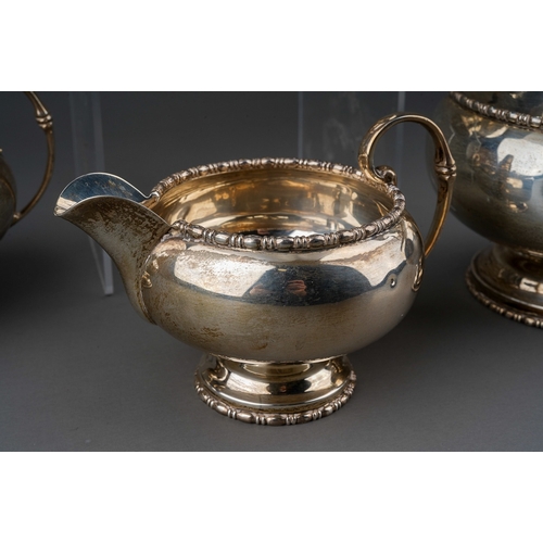 292 - A George VI silver four piece tea set to include: teapot, hot water or coffee jug, sugar bowl and mi... 