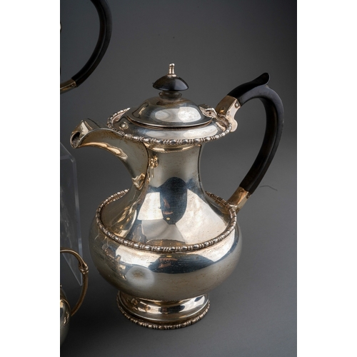 292 - A George VI silver four piece tea set to include: teapot, hot water or coffee jug, sugar bowl and mi... 