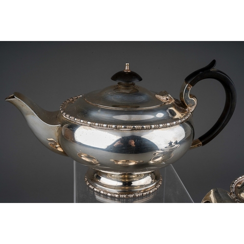 292 - A George VI silver four piece tea set to include: teapot, hot water or coffee jug, sugar bowl and mi... 