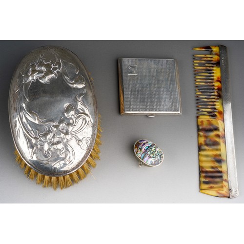 296 - An Art Nouveau silver mounted oval brush, the cover embossed with flowers, hallmarked by William Com... 