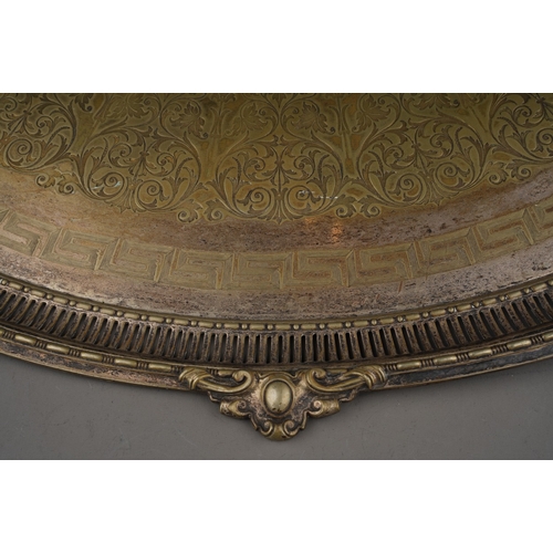 311 - A late Victorian silver plated oval twin handled tray, with engraved centre and cast rim, stamped AB... 