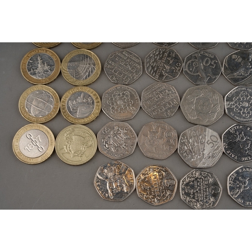 323 - A group of collector picture back 50 pence coins to include: 2004 VC mddal, 2017 Benjamin Bunny, Tom... 