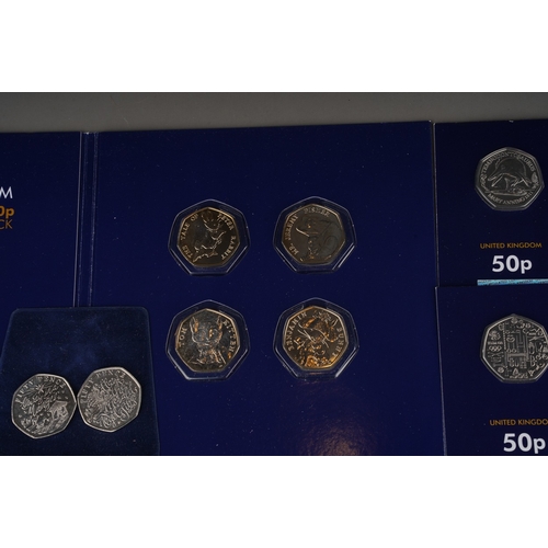 325 - A collection of one hundred and eighteen United Kingdom 50 pence coins, largely special edition,, in... 