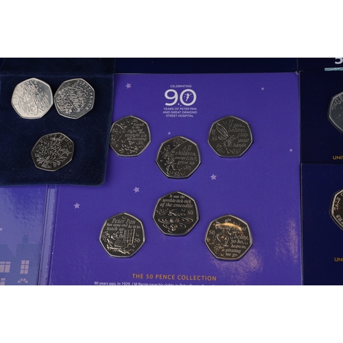 325 - A collection of one hundred and eighteen United Kingdom 50 pence coins, largely special edition,, in... 