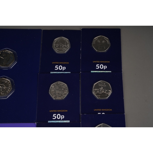 325 - A collection of one hundred and eighteen United Kingdom 50 pence coins, largely special edition,, in... 