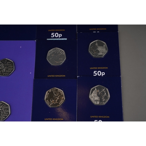 325 - A collection of one hundred and eighteen United Kingdom 50 pence coins, largely special edition,, in... 