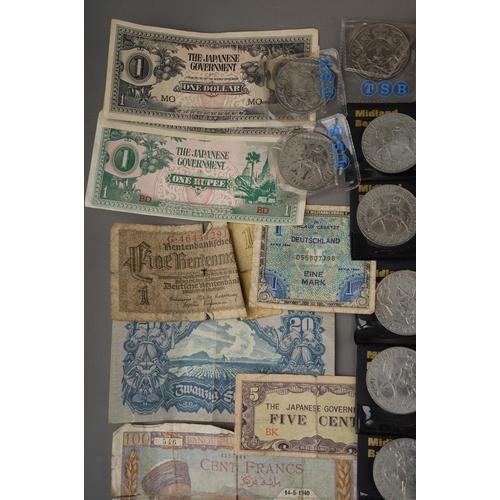 327 - A wooden box of British and World banknotes and coins, including six Elizabeth II ten shilling bankn... 