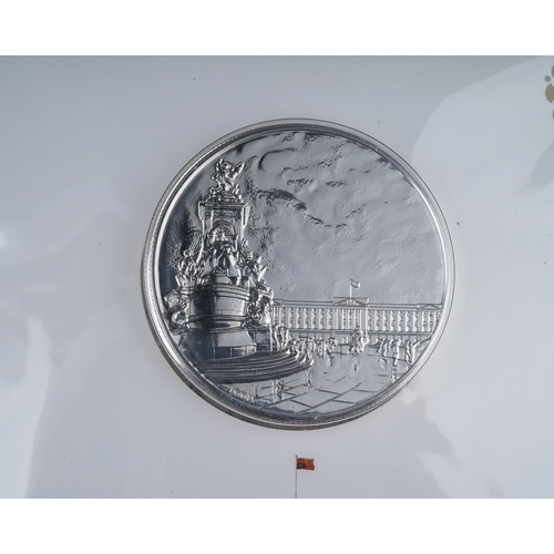 329 - A Royal Mint Buckingham Palace 2015 UK £100 Fine Silver Coin in cardboard and plastic packaging