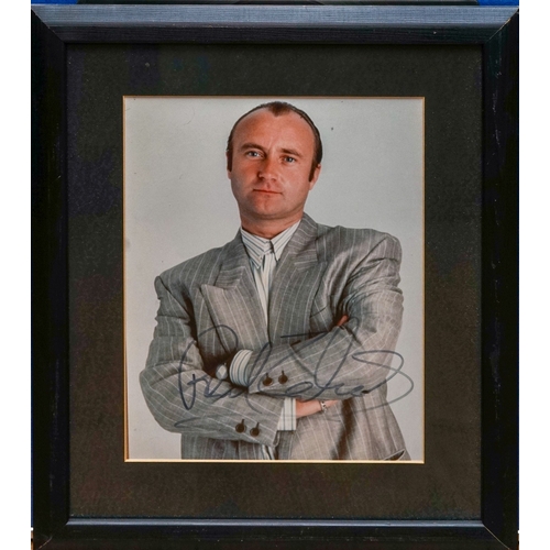 353 - Phil Collins (Genesis) signed 10 x 8 colour photo in a frame measuring approx. 14.5 x 12.5 inches