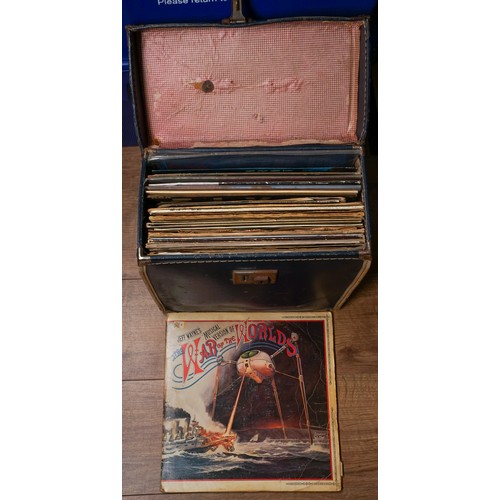 355 - An LP case containing singles, LPs and vintage records, the LPs include Bob Dylan - Slow Train Comin... 