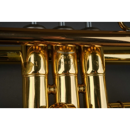 377 - A Yamaha trumpet , model YTR 1335, 40689, mouth piece present, in fitted case, approx 49cm long with... 