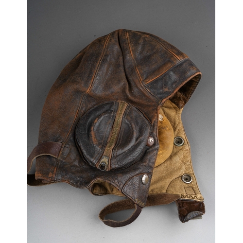 398 - A WW2 brown leather flying helmet, bears label to the interior for Wareings of St. James St, Northam... 