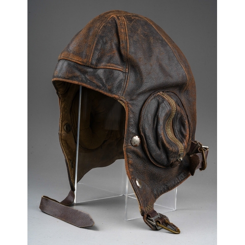 398 - A WW2 brown leather flying helmet, bears label to the interior for Wareings of St. James St, Northam... 