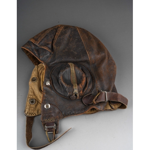 398 - A WW2 brown leather flying helmet, bears label to the interior for Wareings of St. James St, Northam... 