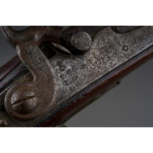 406 - A 19th century percussion pistol converted from a flint lock, stamped Tower GR, walnut with brass bu... 