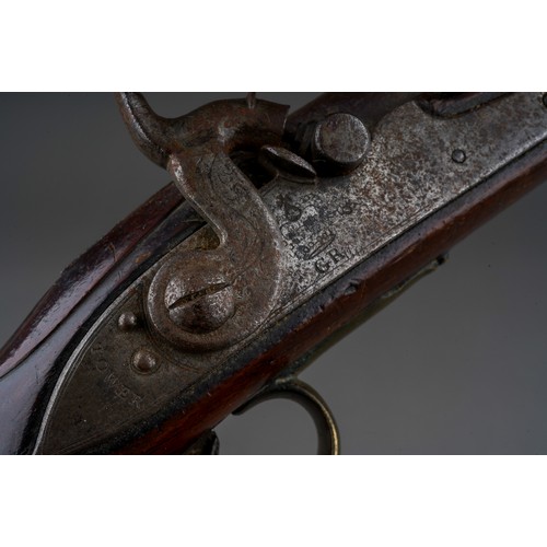 406 - A 19th century percussion pistol converted from a flint lock, stamped Tower GR, walnut with brass bu... 