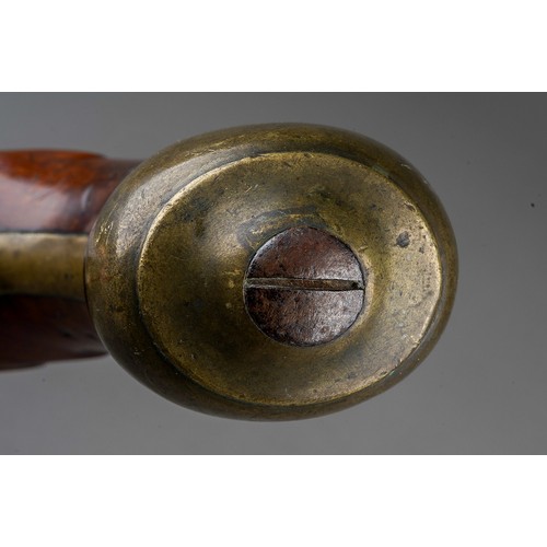 406 - A 19th century percussion pistol converted from a flint lock, stamped Tower GR, walnut with brass bu... 