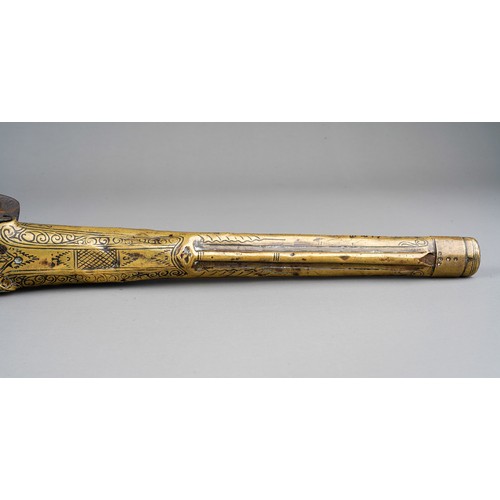 407 - A 19th century miquelet brass flint lock pistol, with stamped decoration throughout, lacks ram rod, ... 