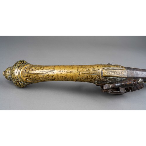 407 - A 19th century miquelet brass flint lock pistol, with stamped decoration throughout, lacks ram rod, ... 