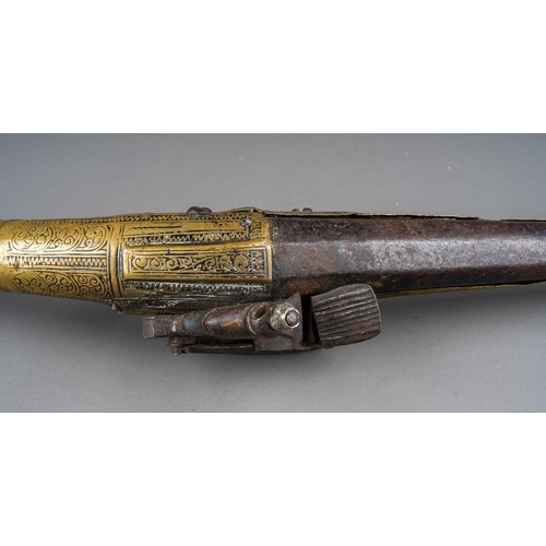 407 - A 19th century miquelet brass flint lock pistol, with stamped decoration throughout, lacks ram rod, ... 