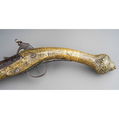 407 - A 19th century miquelet brass flint lock pistol, with stamped decoration throughout, lacks ram rod, ... 