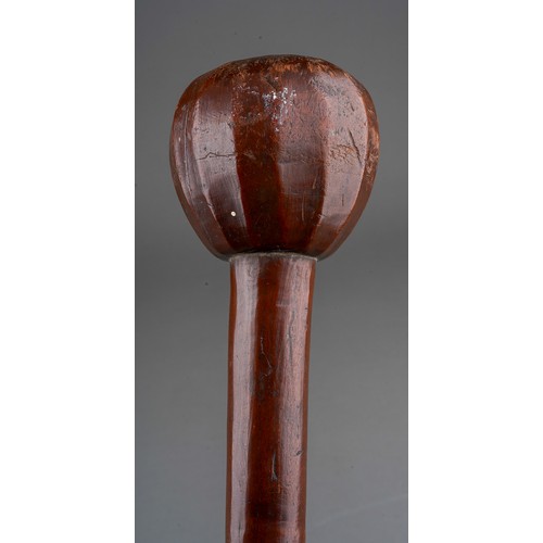 409 - A Knobkerrie, the pommel facet carved, approx 60cm long