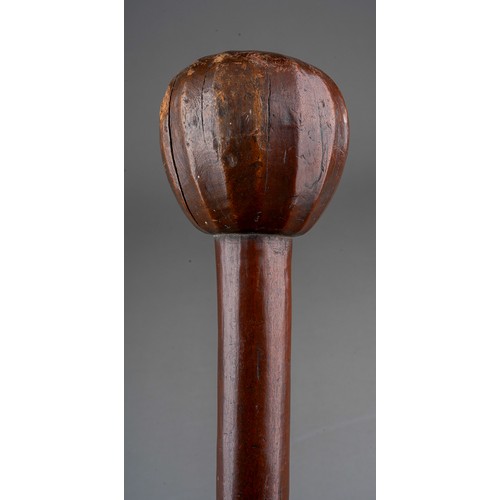 409 - A Knobkerrie, the pommel facet carved, approx 60cm long