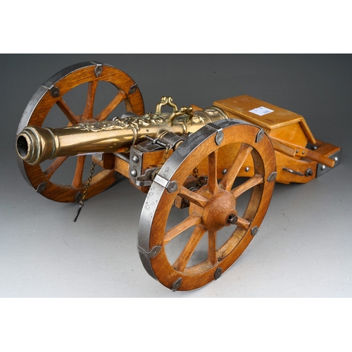 410 - A 20th Century novelty table cigarette holder in the form of an English Civil War Cannon with brass ... 