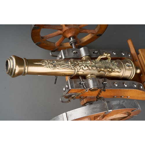 410 - A 20th Century novelty table cigarette holder in the form of an English Civil War Cannon with brass ... 