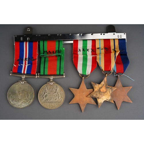 421 - WWII medal group to include: a 1939-1945 Star, Africa Star Italy Star, 1945-1946 War and Defence tog... 