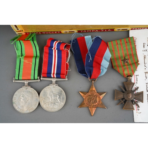 426 - Three WWII medals to include: Defence, Service and Star together with WWI French Military War Cross ... 