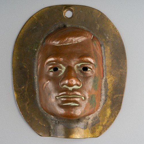 434 - A metal Action Man front of face head mould, height 6.2cm, the mould has been consigned by the perso...