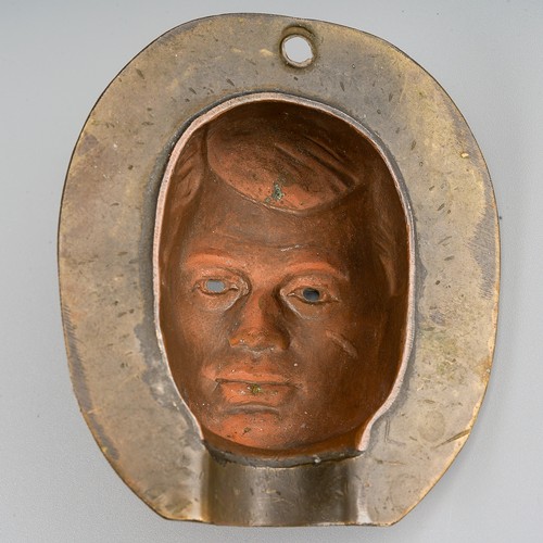 434 - A metal Action Man front of face head mould, height 6.2cm, the mould has been consigned by the perso... 