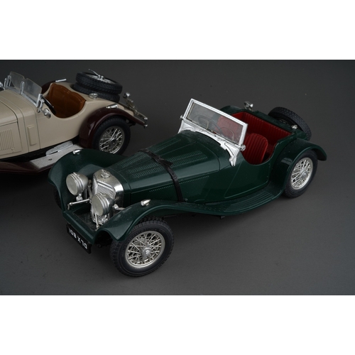 438 - Three Burago 1/18 models of vintage open top cars, comprising a Jaguar SS100, a Mercedes Benz SS4 an... 