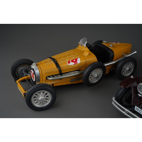 438 - Three Burago 1/18 models of vintage open top cars, comprising a Jaguar SS100, a Mercedes Benz SS4 an... 