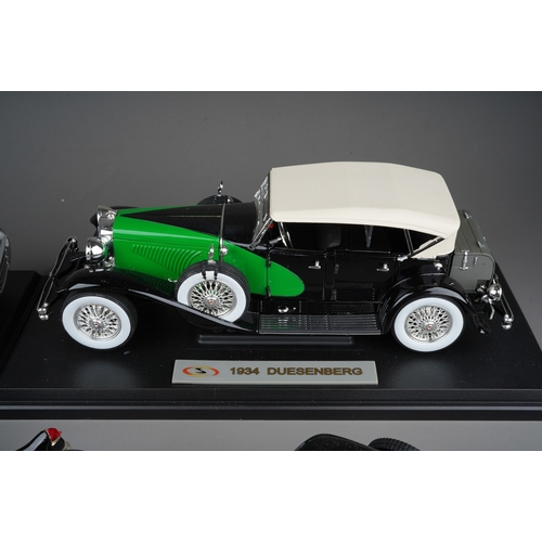 440 - A collection of seven die cast model cars, mainly 1:18 to include: mounted 1934 Duesenberg; Danbury ... 