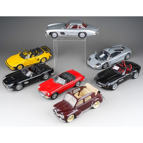 442 - A collection of seven die cast 1/18 model cars to include: Minichamps Mercedes-Benz 300 SL; UT Model... 