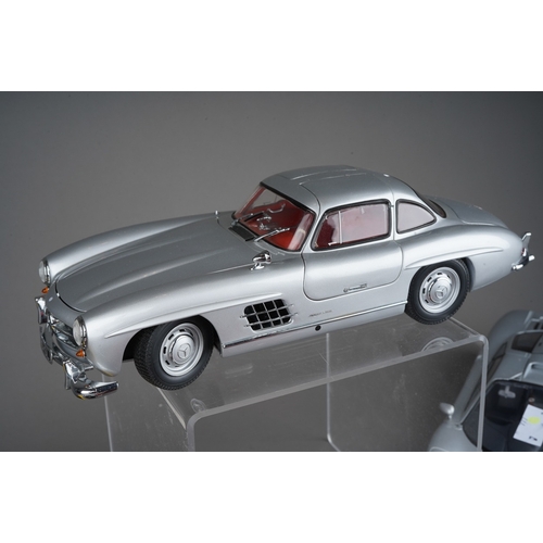 442 - A collection of seven die cast 1/18 model cars to include: Minichamps Mercedes-Benz 300 SL; UT Model... 