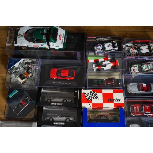 444 - A boxed Exclusiv Car 1:18 Lancia Rally car together with a large collection of mainly die cast mainl... 