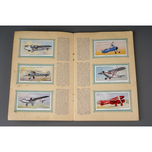 458 - Four 1930s cigaratte card albums to include: John Player & Sons Motor Cars (1st and 2nd Series)  and... 