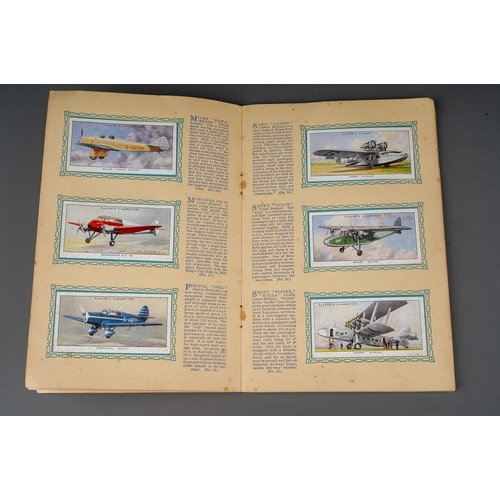 458 - Four 1930s cigaratte card albums to include: John Player & Sons Motor Cars (1st and 2nd Series)  and... 